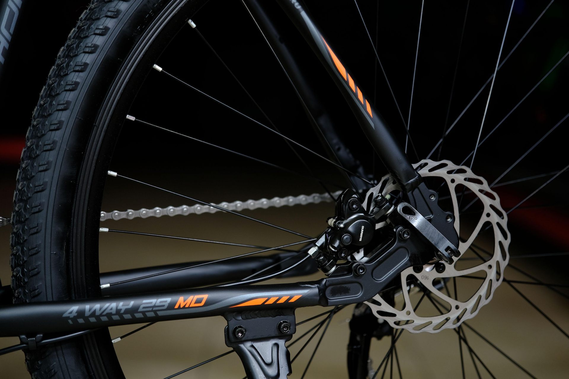 Тормоз дисковый гидравлический Shimano MT200 160мм
 HOKE 4 Way 29 HD матовый чёрный-оранжевый 21